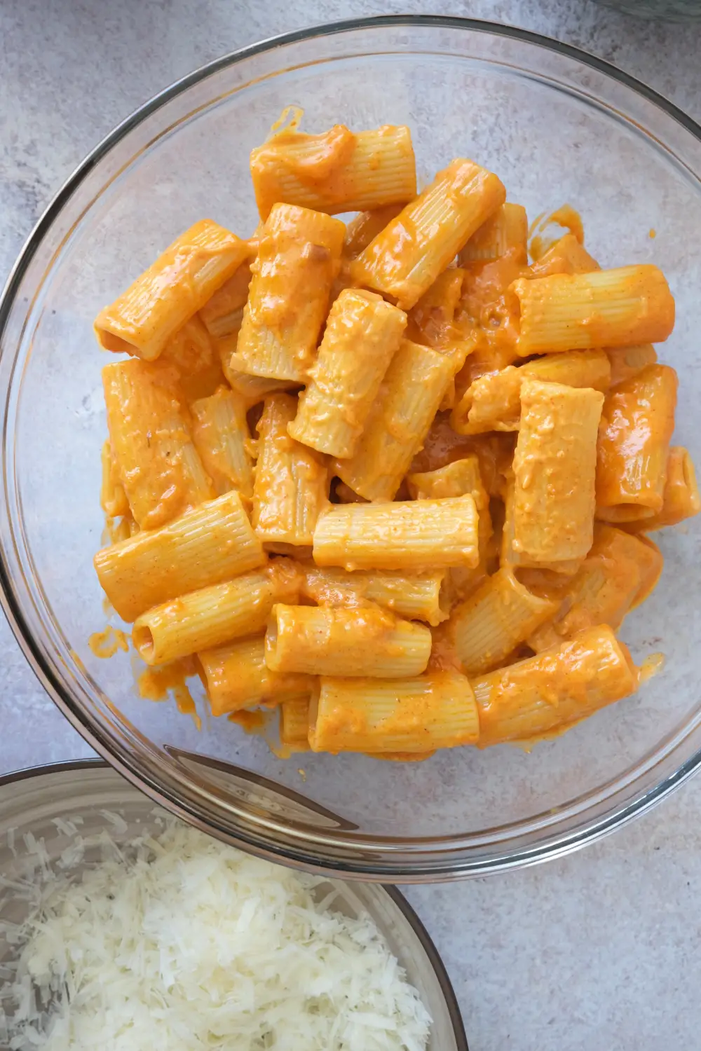 Rigatoni tossed in creamy gochujang sauce before adding garnish.