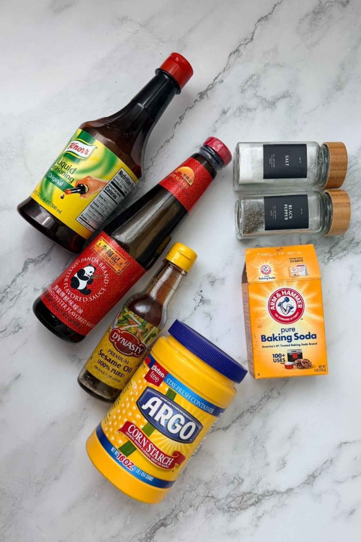 Ingredients for pork siomai: oyster sauce, Knorr seasoning, sesame oil, salt, pepper, cornstarch, and baking soda.