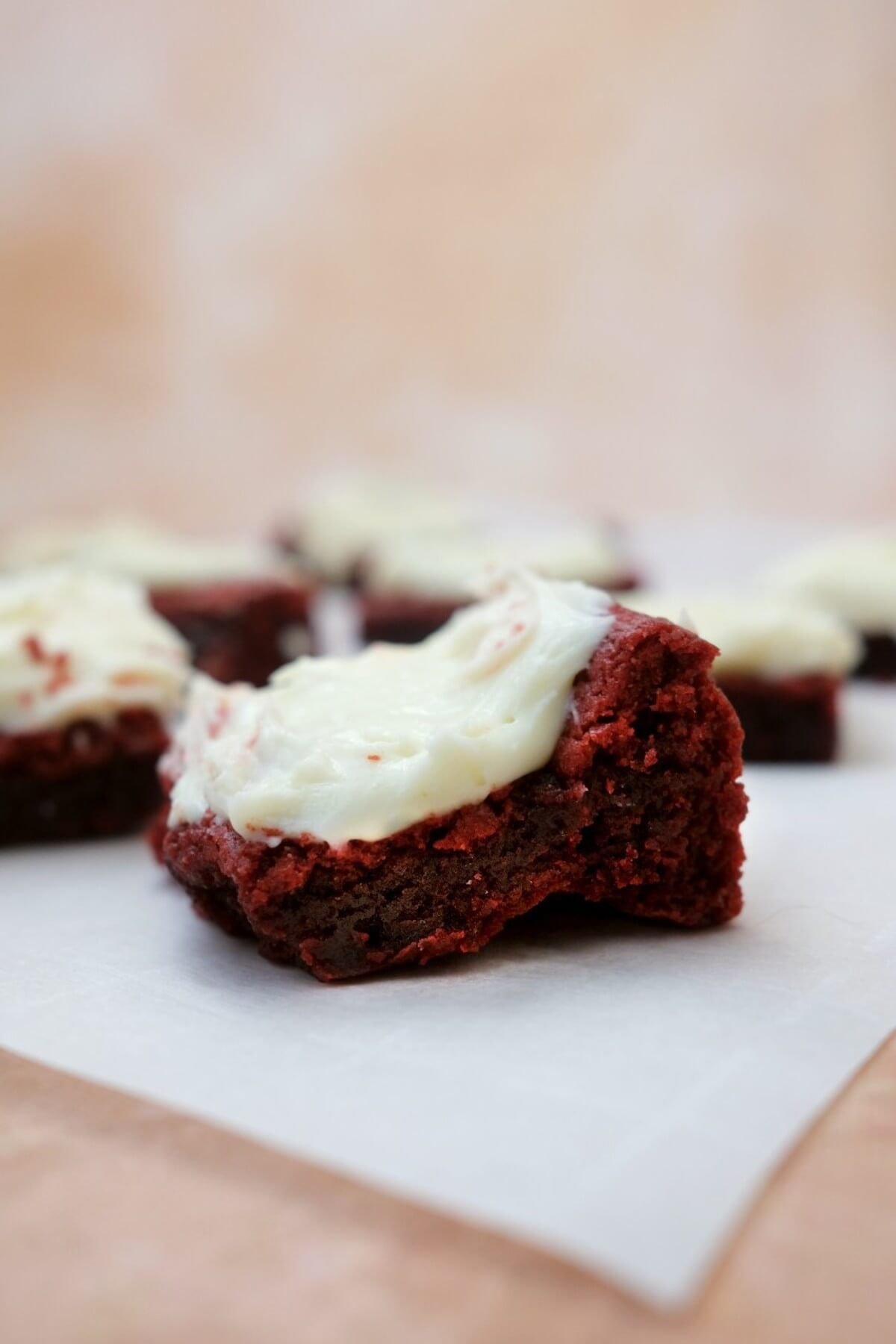 Red velvet brownie topped with cream cheese frosting