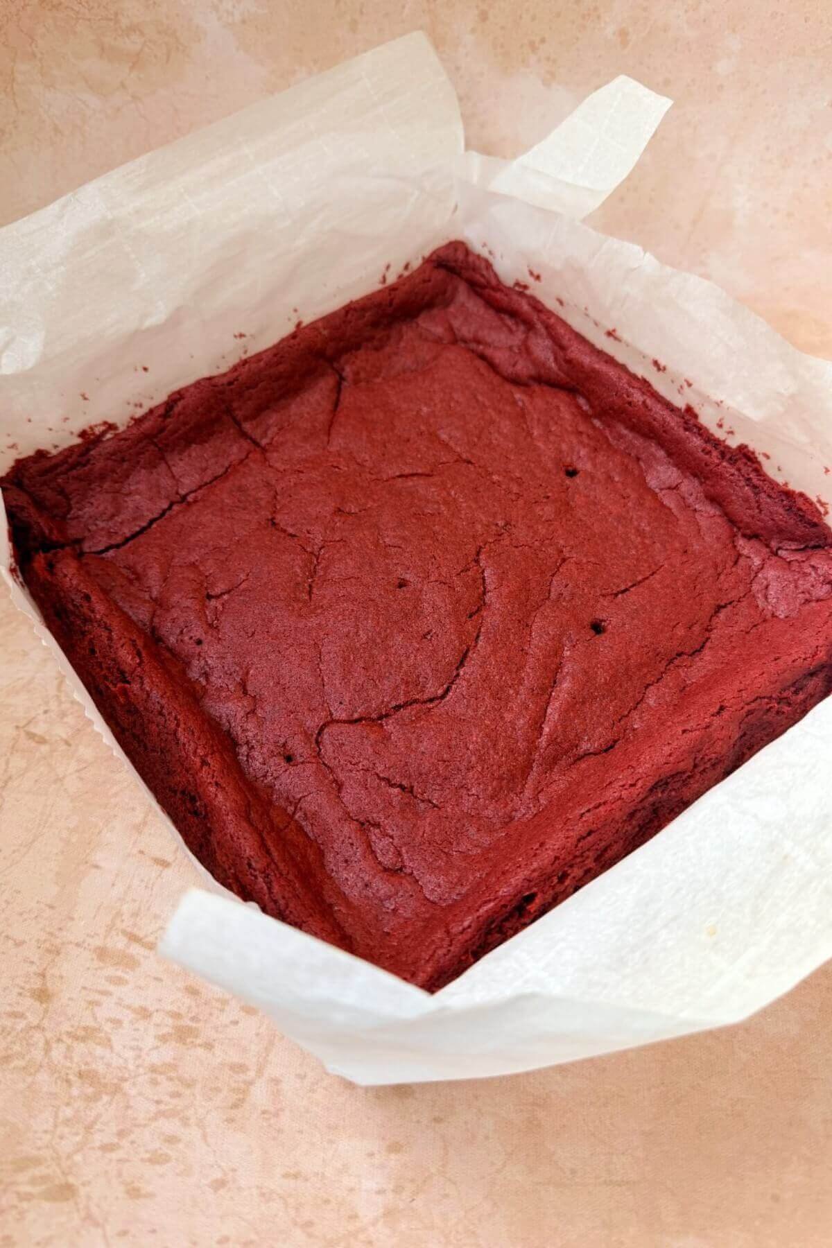 Freshly baked red velvet brownies in  a pan 