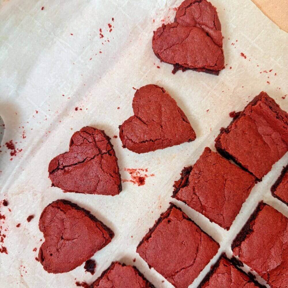 Red velvet brownies cut into hearts and squares.