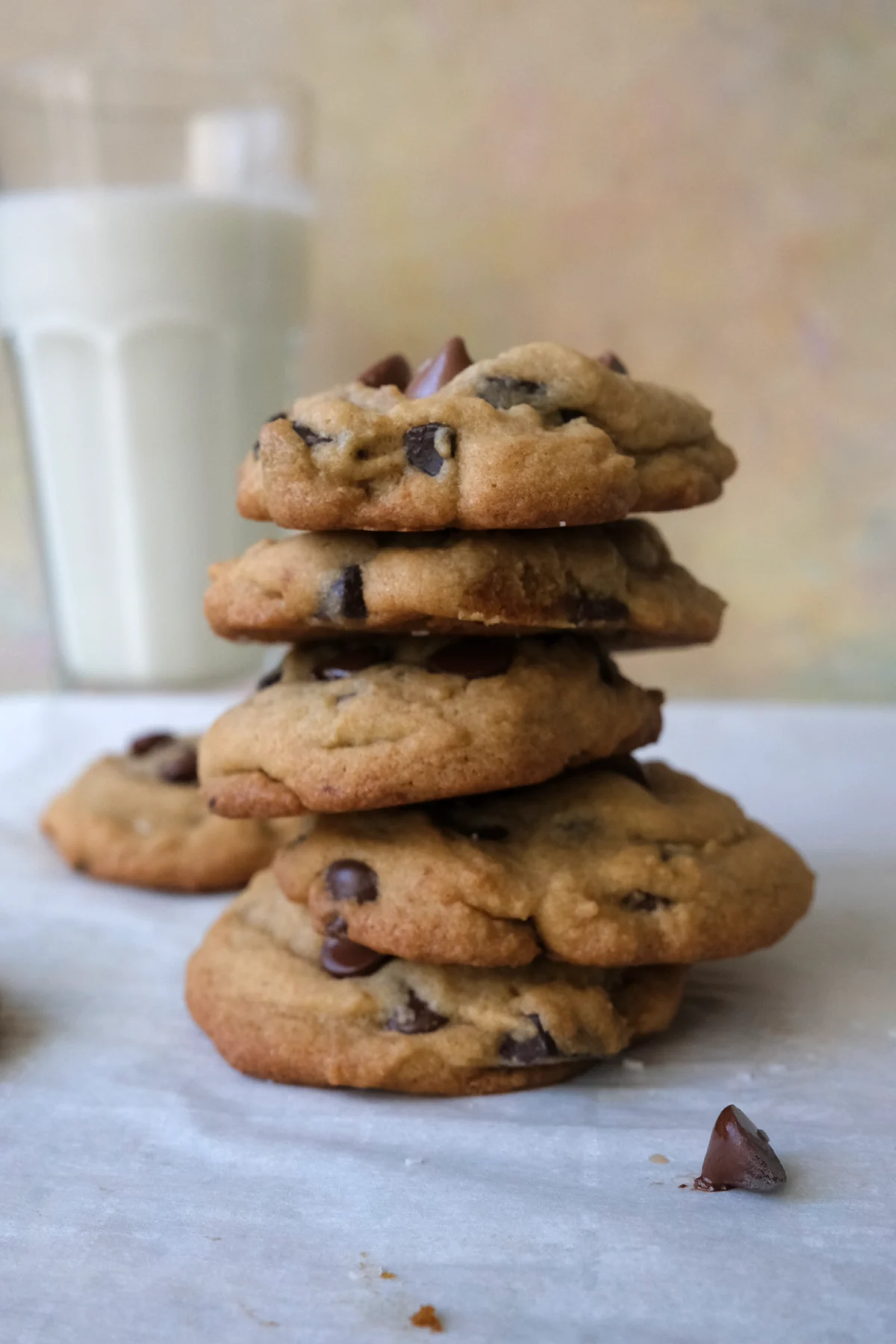 Stack of soft and chewy brown sugar chocolate chip cookies with golden edges and melted chocolate chips.