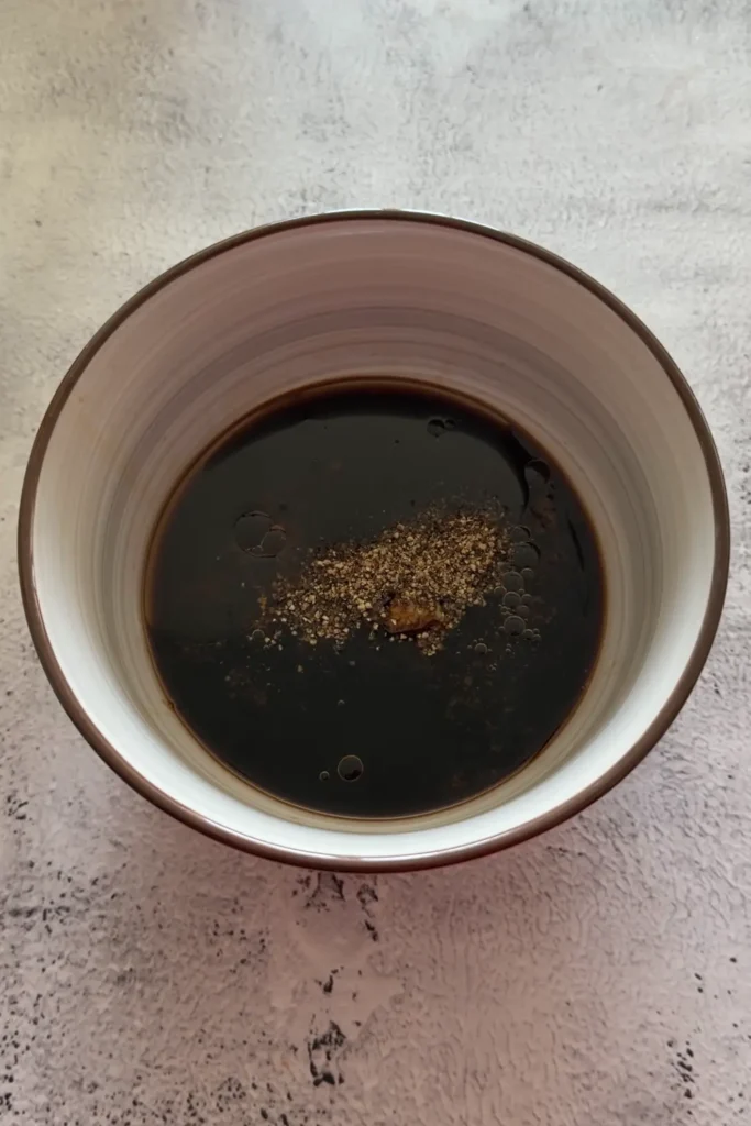 Bulgogi sauce made with soy sauce, sesame oil, brown sugar, garlic, and ginger in a bowl