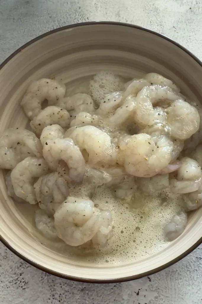Shrimp marinating in beaten egg whites