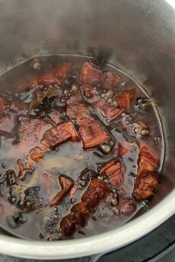 Pork belly braising in soy sauce and spices in Instant Pot