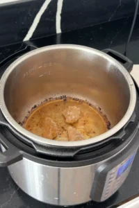 Rock sugar melting in Instant Pot to make caramel for Hong Shao Rou