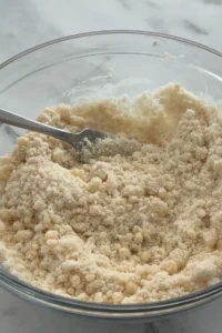 Shortbread crust mixture with melted butter mixed into flour and sugar.