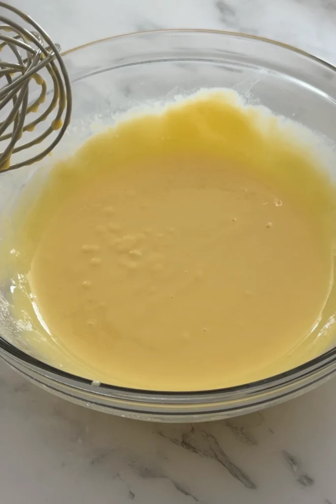 Whisked lemon filling made with egg yolks and condensed milk.