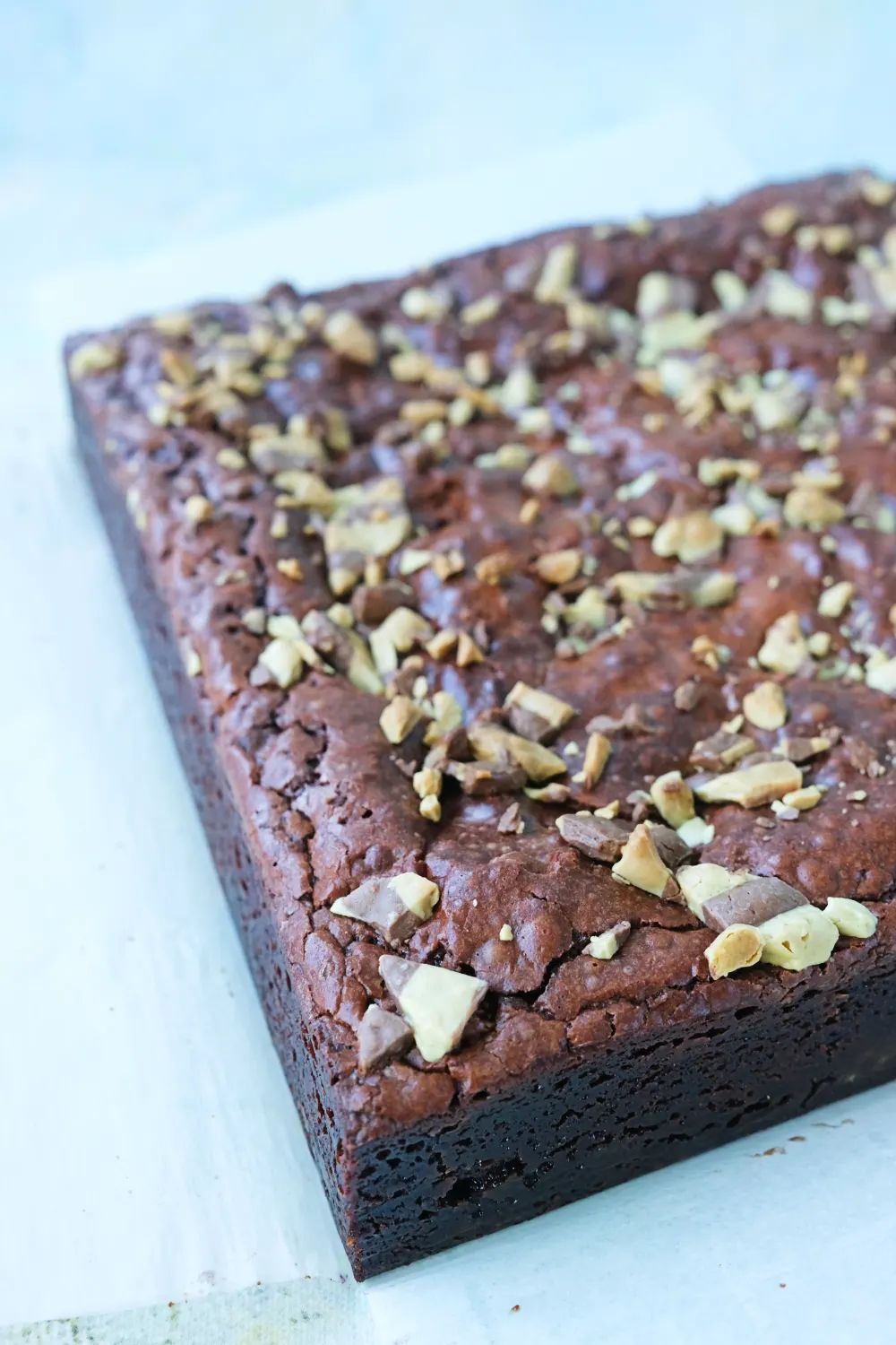 Close-up of brownie surface with crackly crust and chocolate chunks