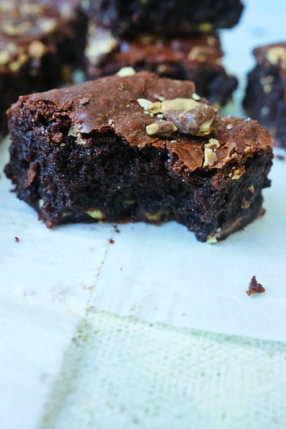 Fudgy mint chocolate chip brownie with crackly top and gooey center close-up