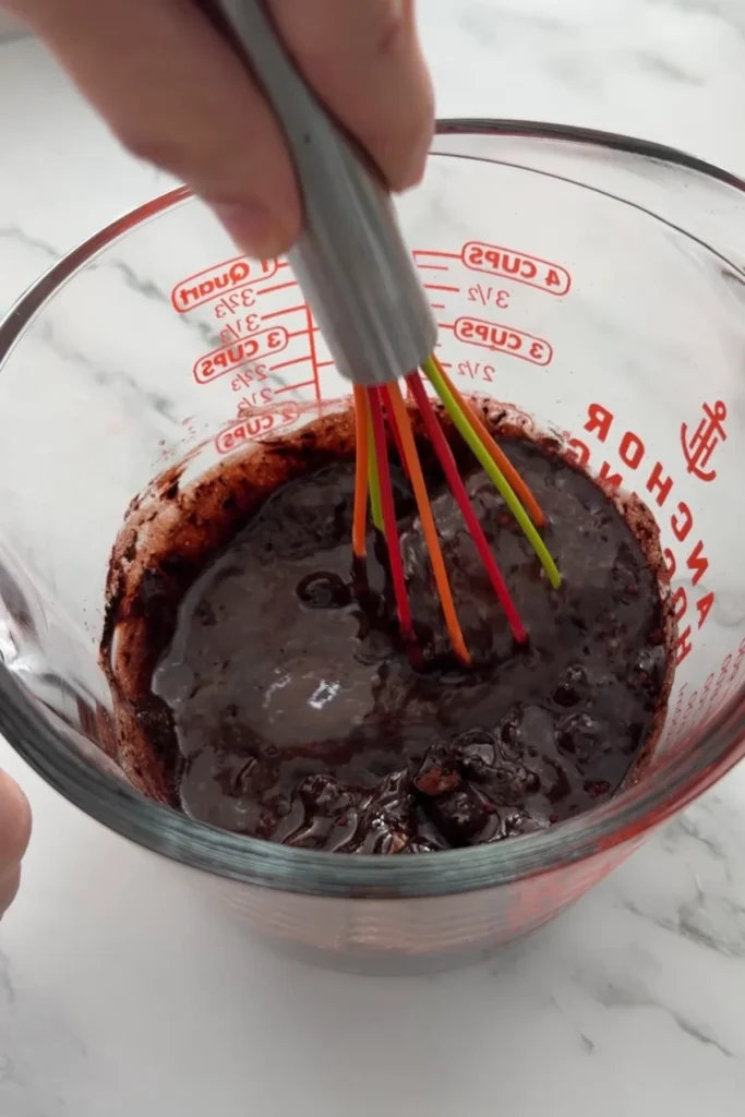 Thick chocolate mixture after combining melted ingredients