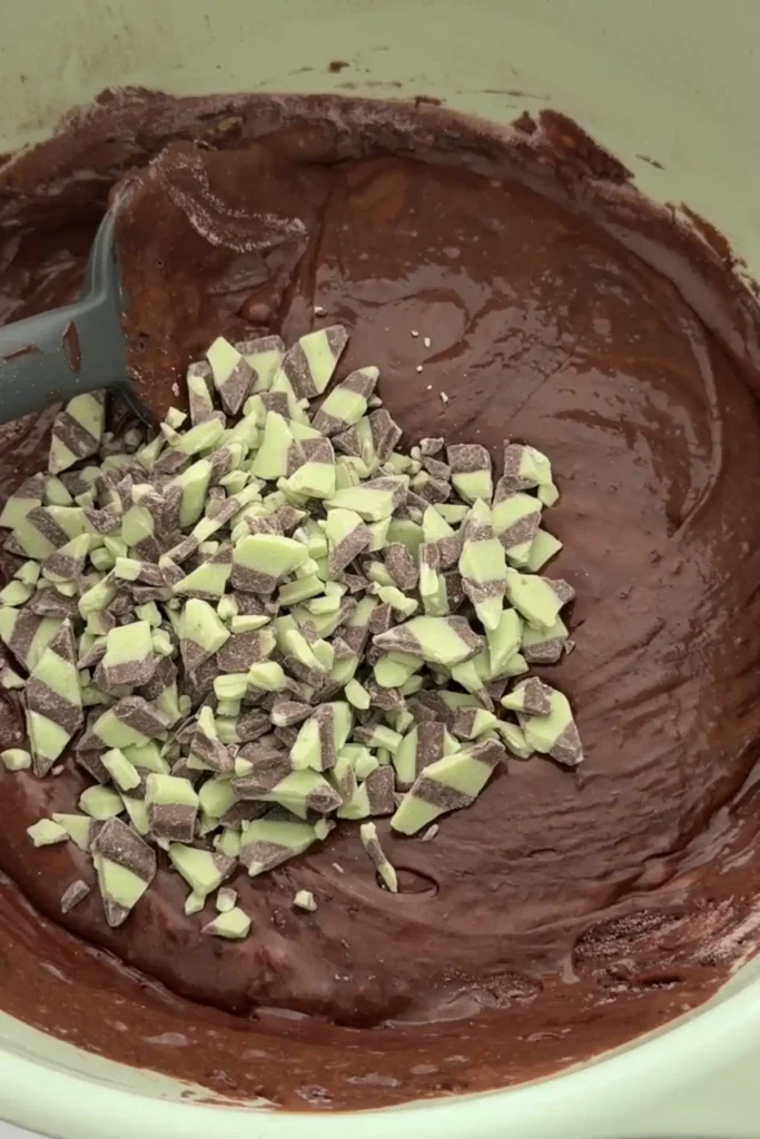 Chopped mint chocolate pieces added to rich brownie batter