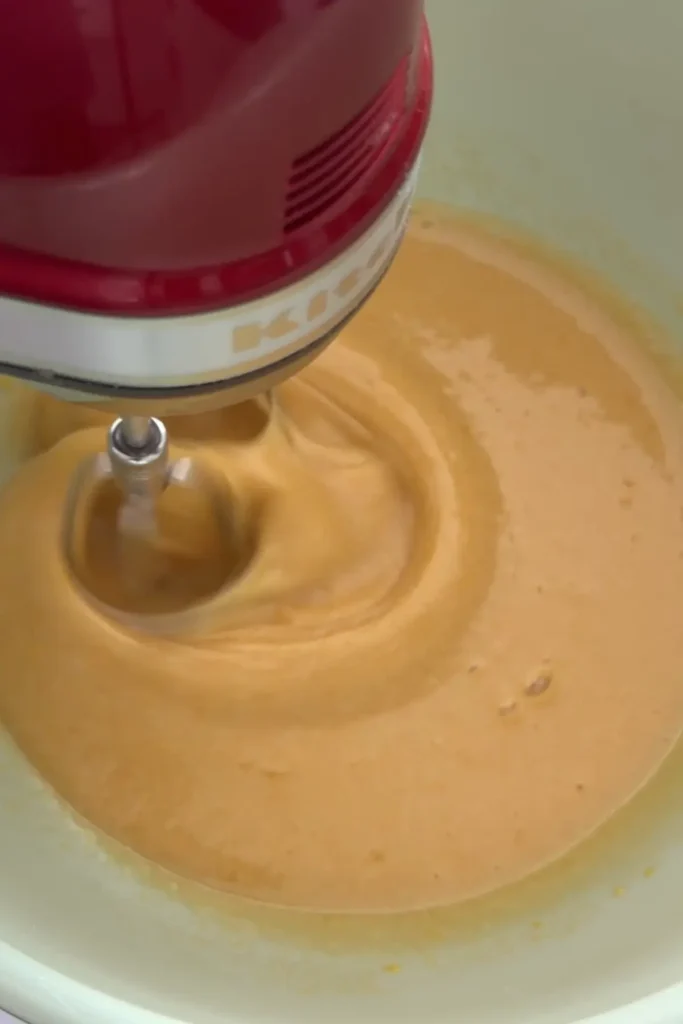 Whipping eggs and sugar into a pale golden mixture for brownies