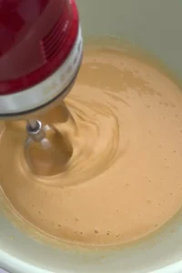 Smooth glossy egg mixture after whipping for brownie batter