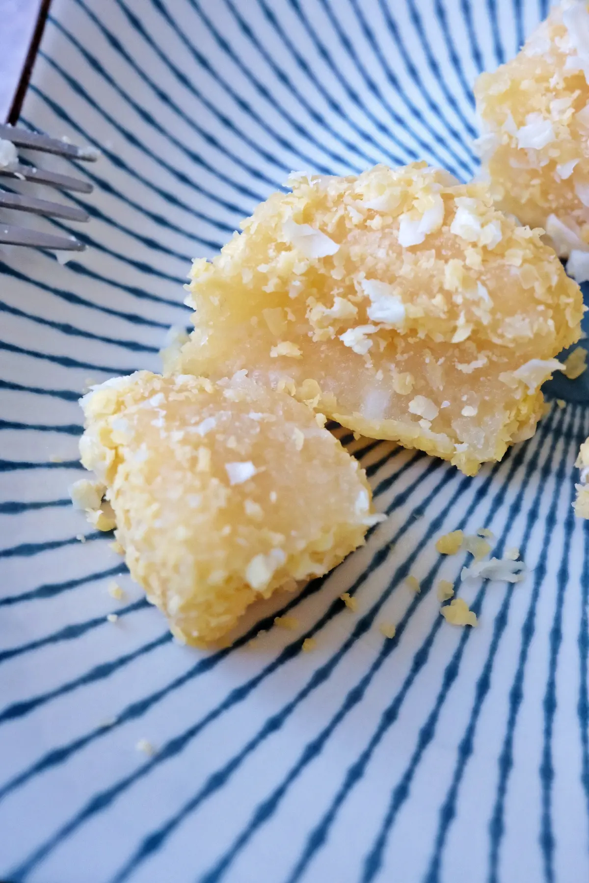 Close-up of pichi pichi cassava dessert showing soft chewy texture