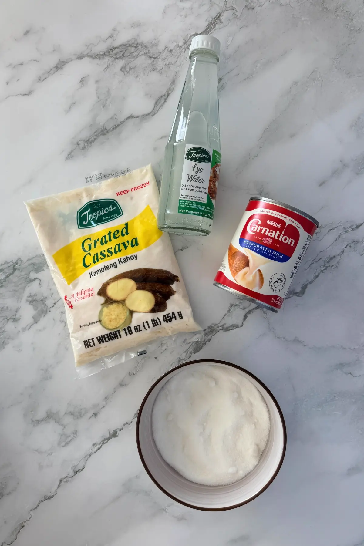 Ingredients for pichi pichi: grated cassava, lye water, sugar, and evaporated milk