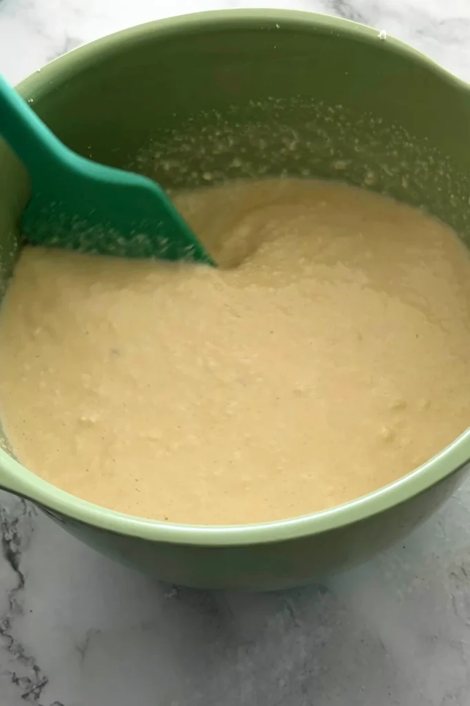 Cassava mixture for pichi pichi being stirred in a bowl