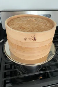 Bamboo steamer on the stovetop used to steam pichi pichi