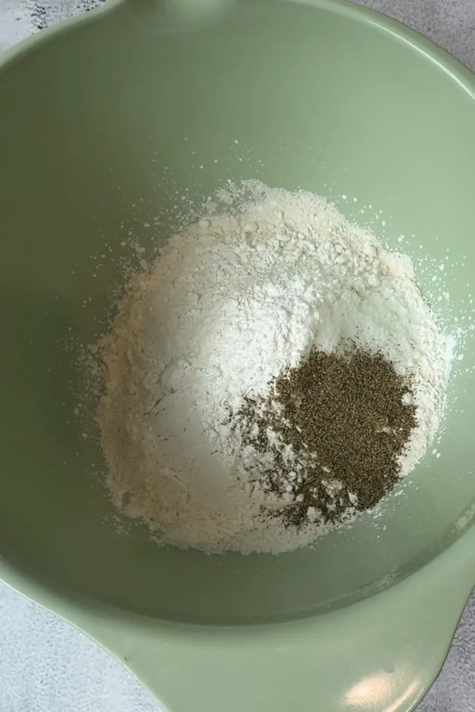 Bowl with flour, cornstarch, salt, and black pepper for fish taco batter
