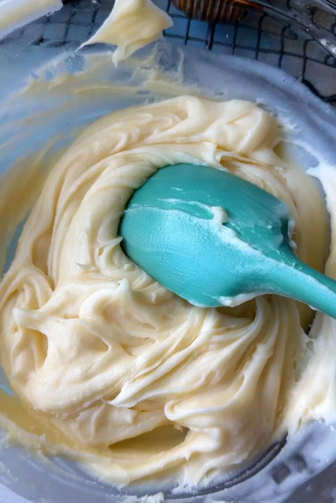 Cream cheese frosting in a bowl.