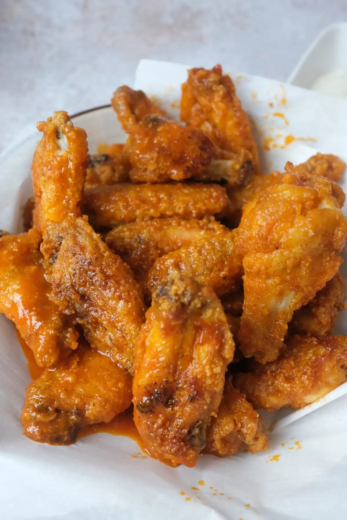 Crispy air fryer buffalo wings coated in glossy homemade buffalo sauce and served with creamy ranch dip.