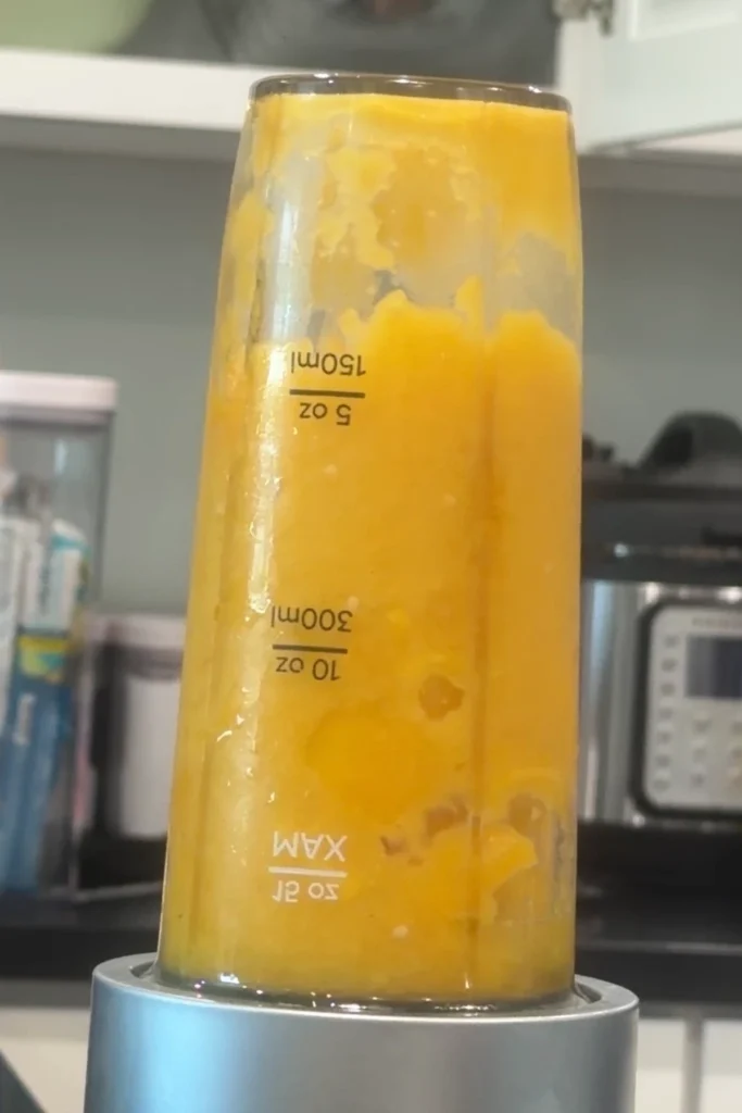 Mango habanero sauce blended in a small blender cup until smooth.