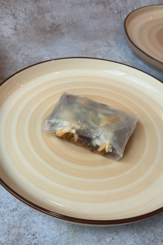 Folded rice paper dumpling ready to be fried until crispy and golden.