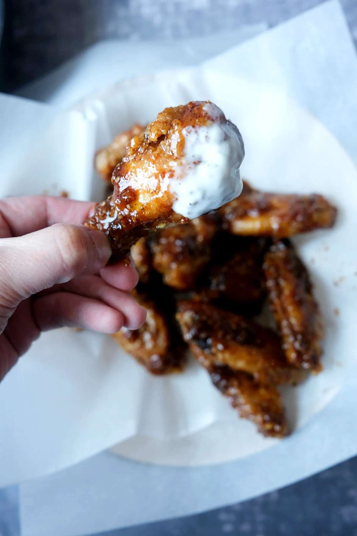 Crispy soy garlic wing dipped into creamy ranch dressing.