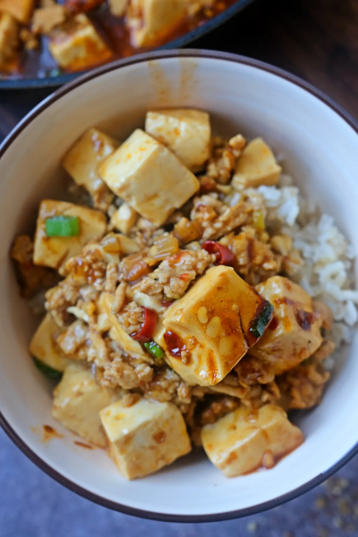 Easy chicken mapo tofu recipe with soft tofu cubes in a spicy savory sauce.