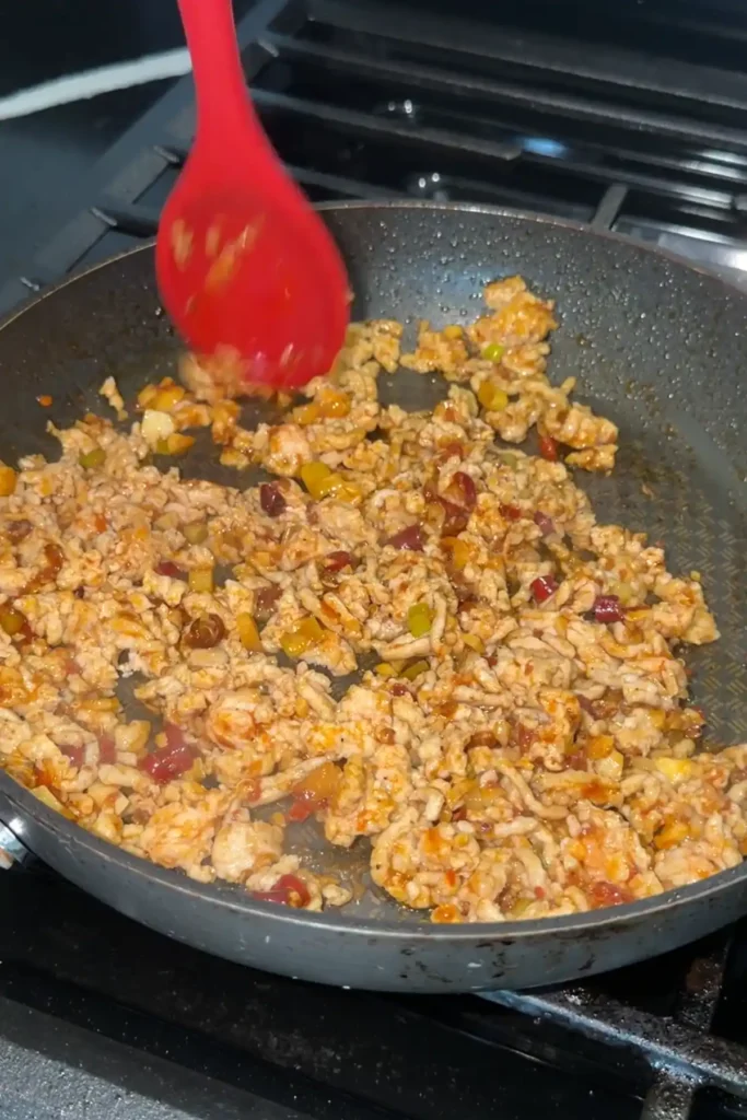 Ground chicken cooked and crumbled with aromatics for homemade mapo tofu.