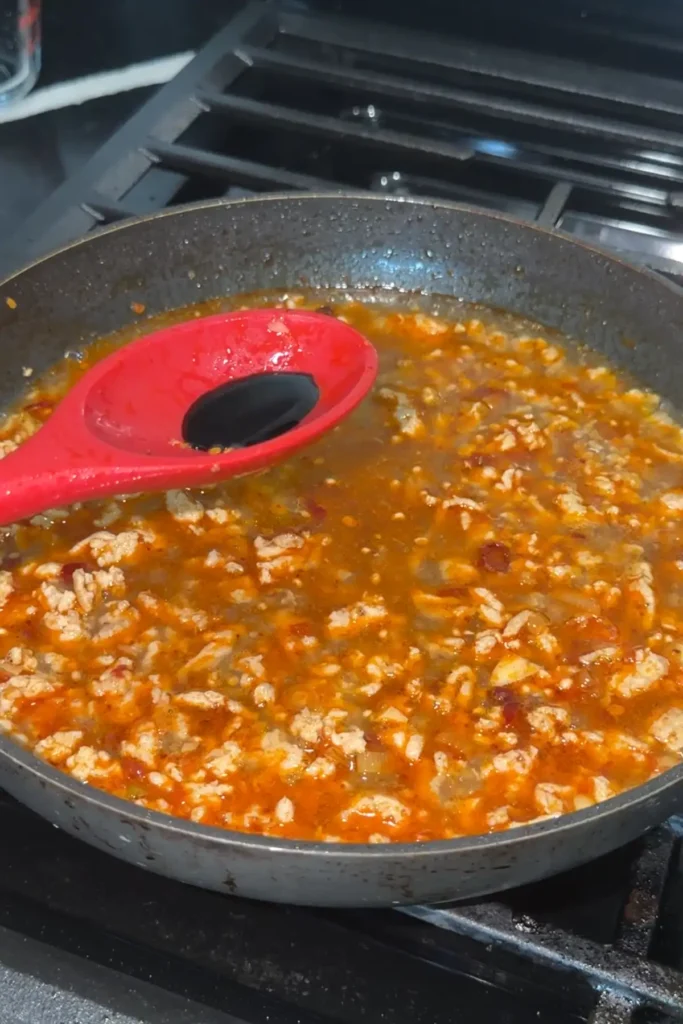 Dark soy sauce added to the simmering chicken mapo tofu sauce base.