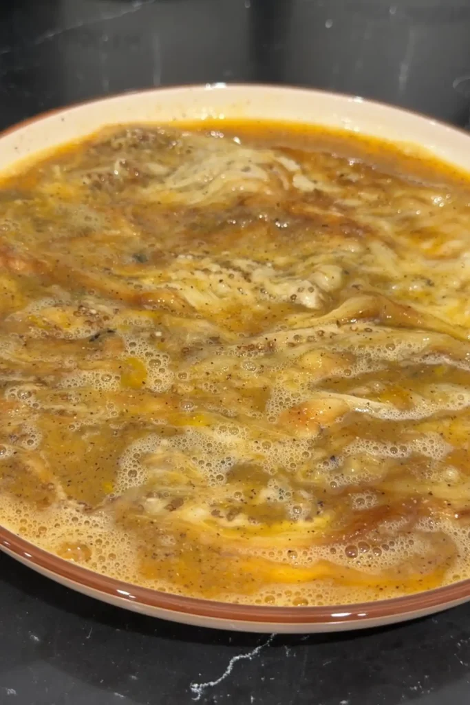 Mashed roasted eggplants in seasoned egg mixture.