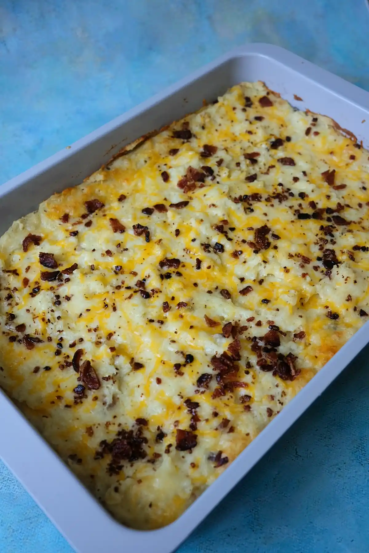 Loaded baked potato casserole baked until golden and bubbly in a casserole dish.