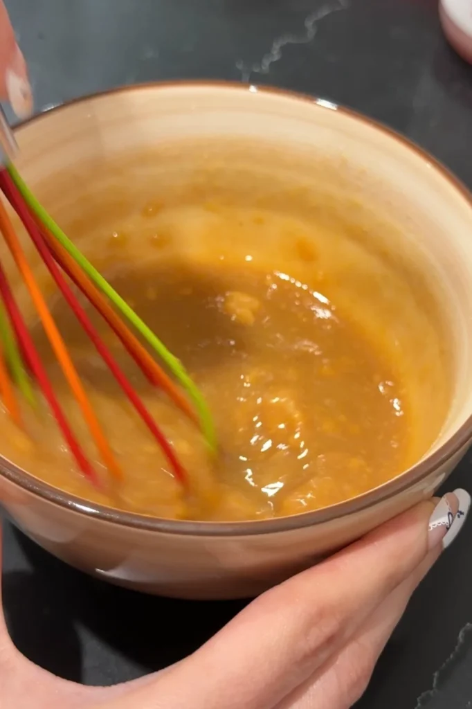 Whisking homemade miso glaze for Chilean sea bass