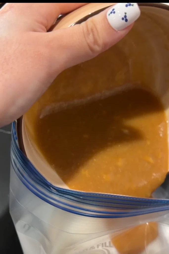 Pouring homemade miso glaze over Chilean sea bass fillets