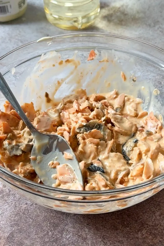 Creamy salmon filling mixed with mayonnaise, soy sauce, and sriracha for salmon onigiri