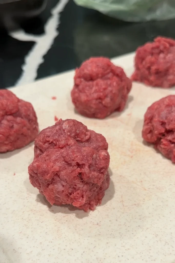 Ground beef divided into portions for making smash burger tacos