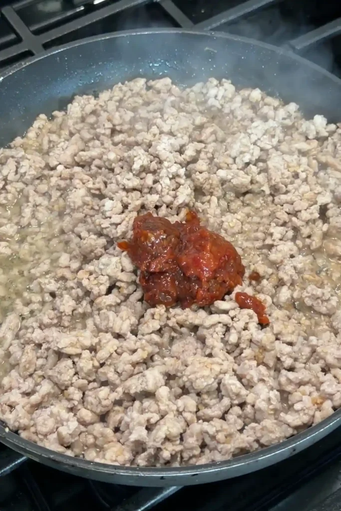 Ground pork seasoned with doubanjiang while cooking for homemade tantanmen ramen
