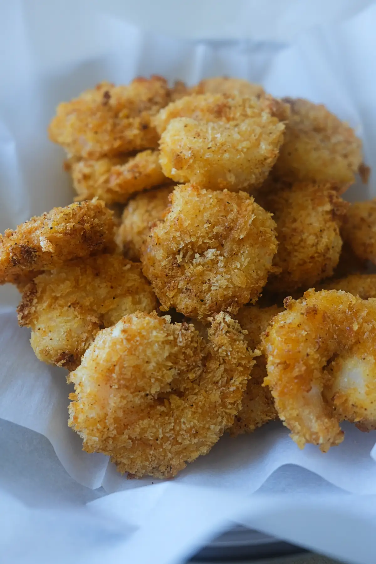 Golden brown popcorn shrimp made in the air fryer with a crispy panko crust