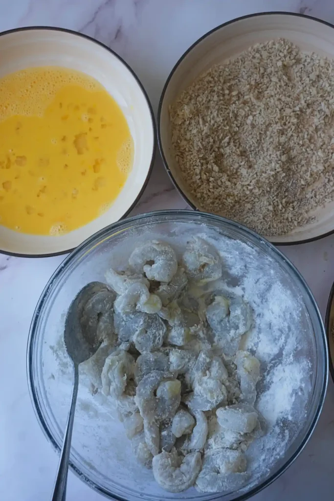 Breaded shrimp station with flour coated shrimp, egg wash, and panko breadcrumbs