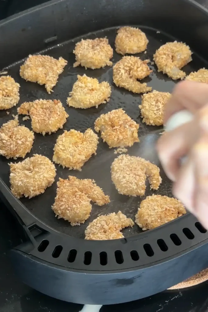 Air fryer popcorn shrimp sprayed lightly with oil for a crispy golden finish