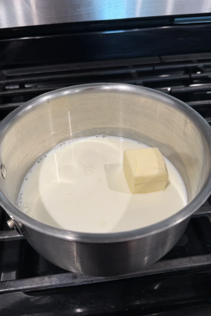 Butter and milk in a saucepan before heating.