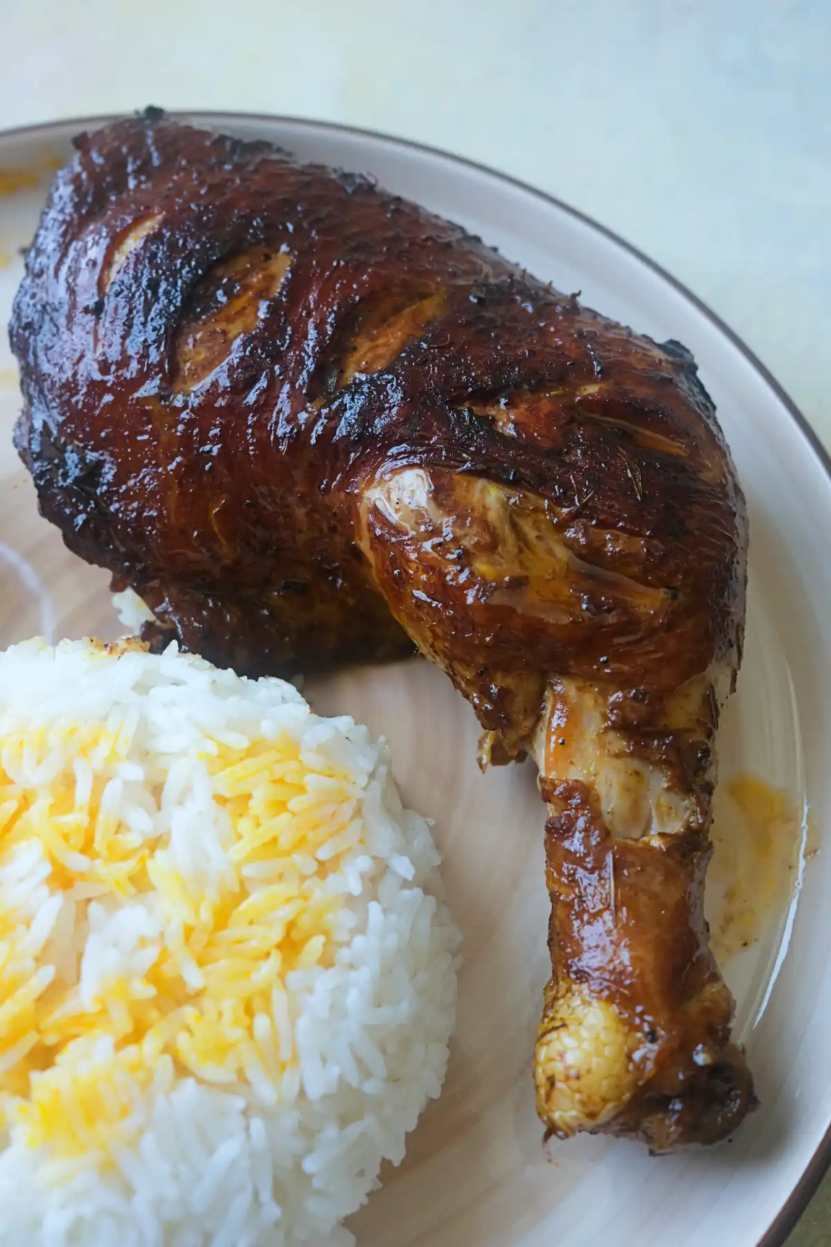 Filipino Chicken Inasal with crispy skin served alongside steamed white rice