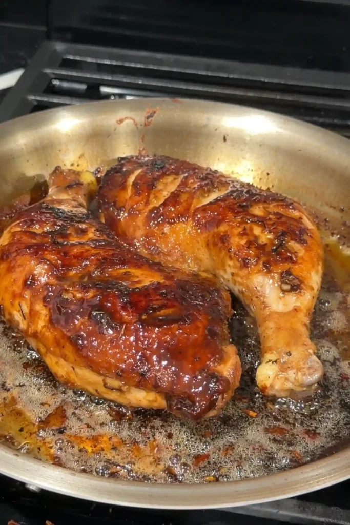 Chicken Inasal with caramelized skin and a glossy annatto oil glaze