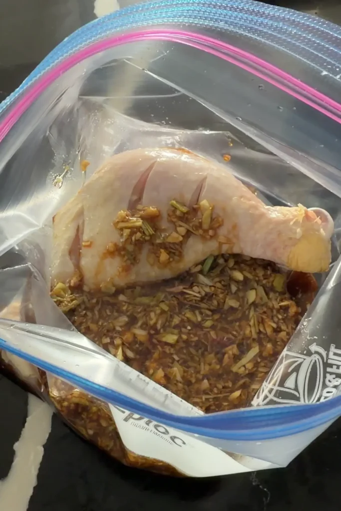 Marinating Chicken Inasal in a flavorful soy sauce and lemongrass marinade