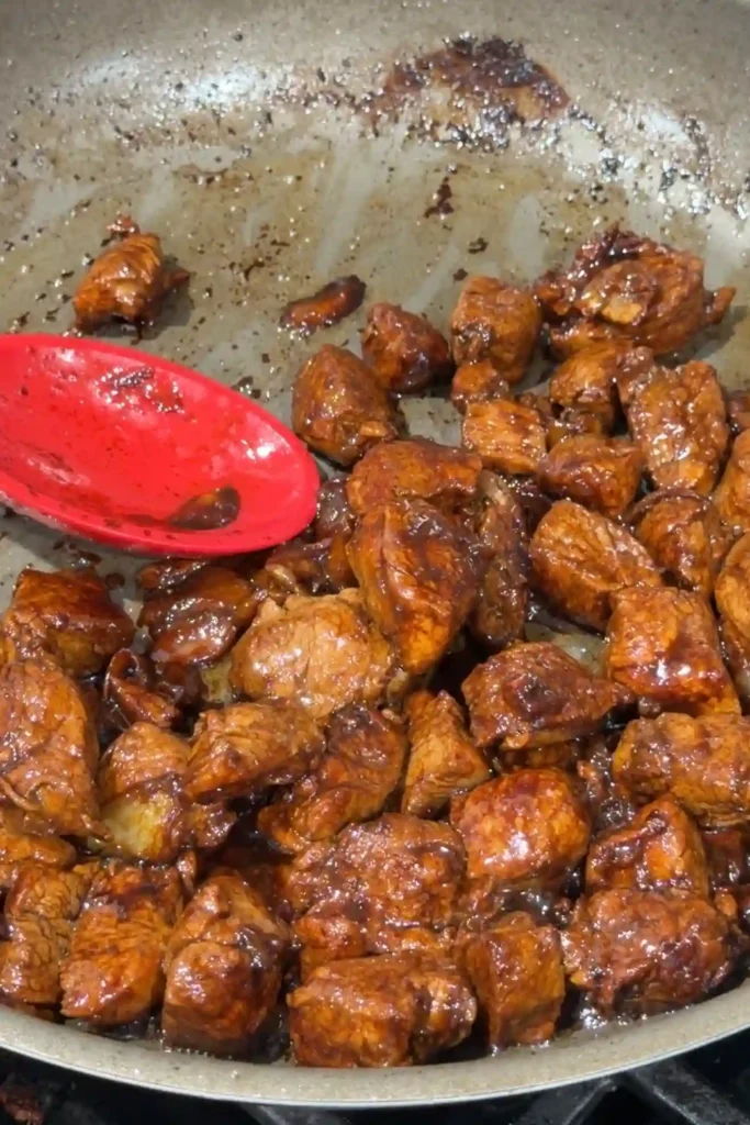 Pork salpicao tossed in the reduced garlic butter sauce until evenly coated.