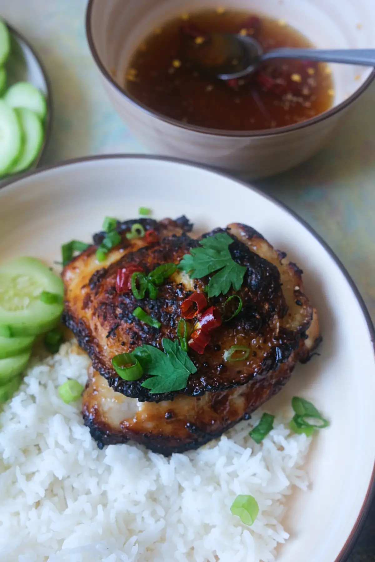 Vietnamese lemongrass chicken rice bowl featuring juicy bone-in chicken thigh marinated with lemongrass, fish sauce, garlic, and brown sugar.