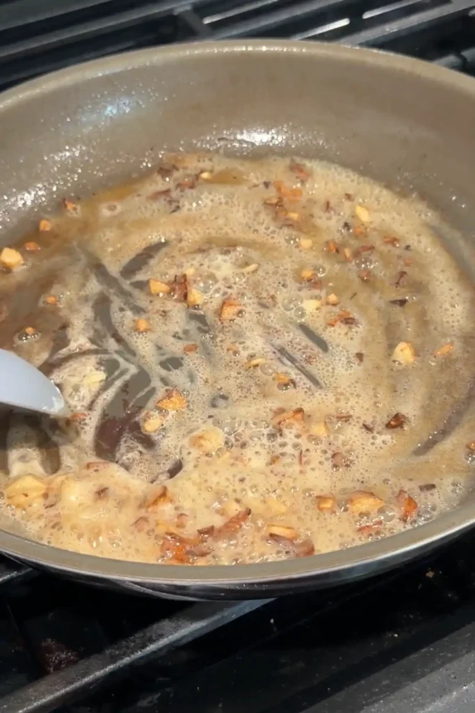 Garlic and flour stirred into the butter to form the base of the sauce.