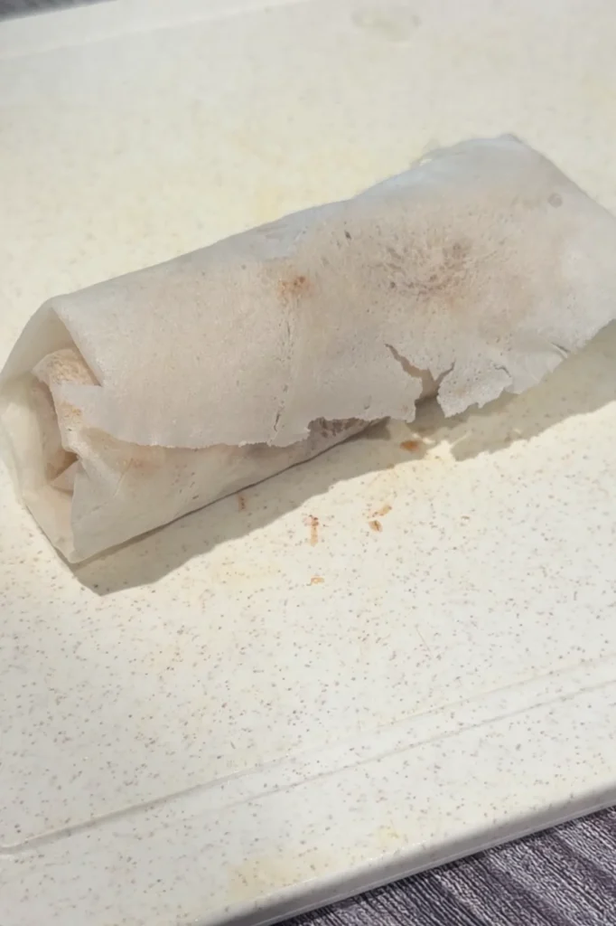 Rolled apple turon wrapped and ready for frying.