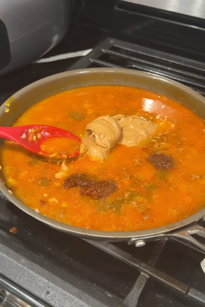 Bagoong added to the peanut butter sauce for ground beef kare kare.